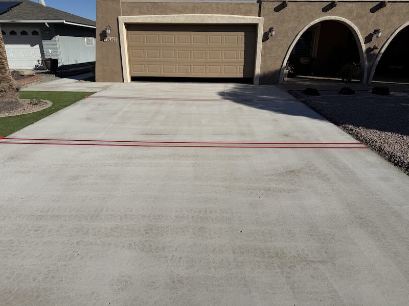Driveway Concrete With Severe Pitting and Cracks