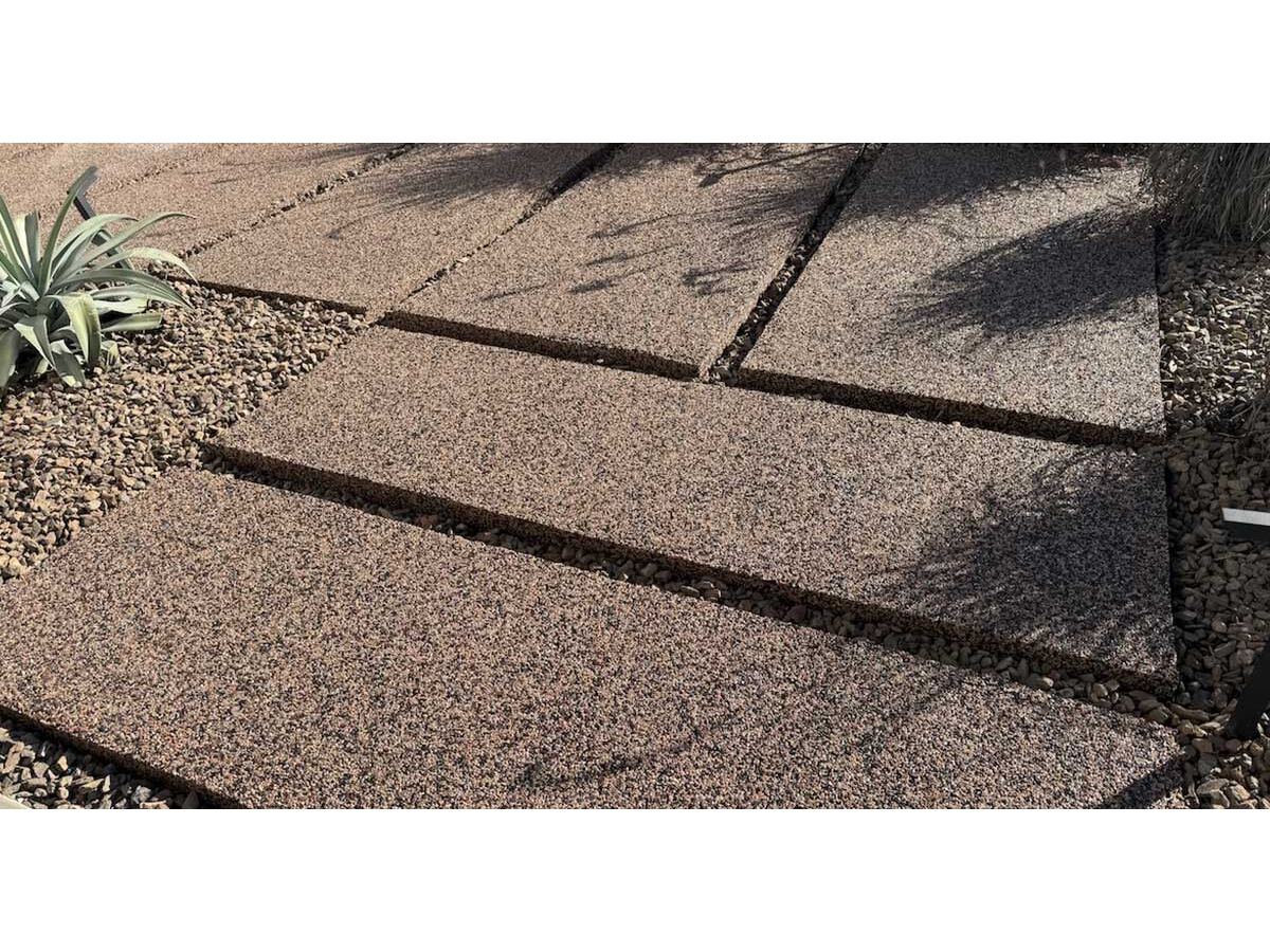 Decorative river rock concrete coating installed by Carefree Stone